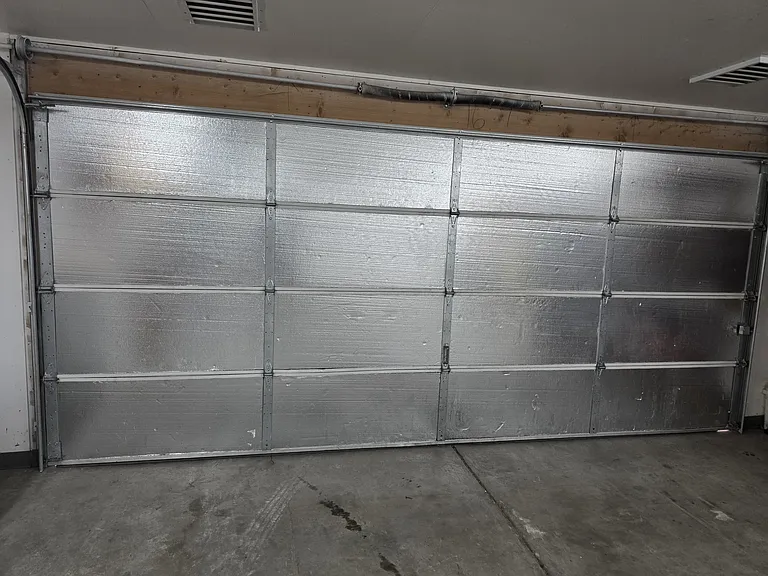 Two car garage door that's 8' high