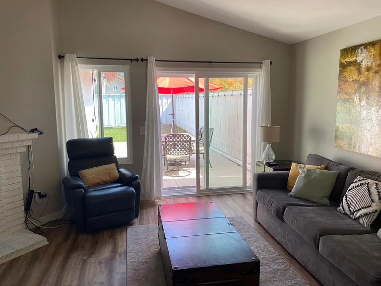 Living room leading to patio/backyard