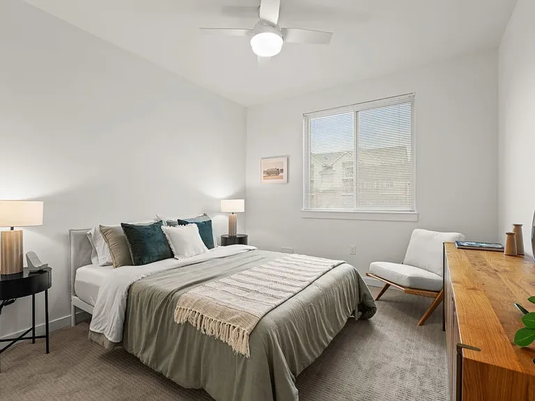 Spacious carpeted bedrooms with ceiling fans.