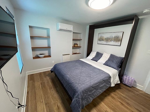 Master Queen size bedroom across from the full-size bedroom in the back of the apartment.
