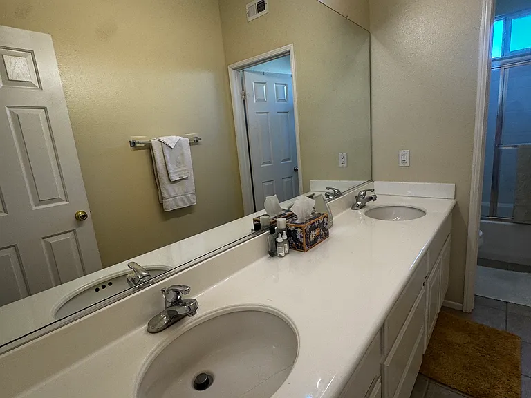 Shared bathroom: bright, clean, two sinks, plenty of drawers and cabinet space for each tenant to store toiletries.