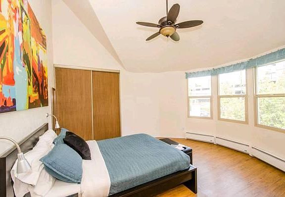 Bay windows and lofted ceilings give this bedroom a spacious and unique feel. Can't find a bedroom anywhere else is Queen Anne like it!