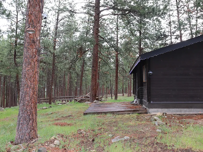 Deck in back facing acres of forested land. Nice place to relax.