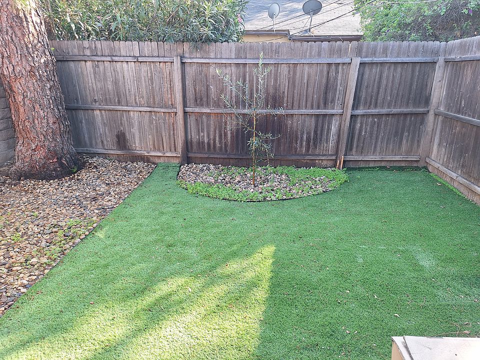 Wonderful outdoor area for small pets. The rocks to the left are for potty time and the backyard has its own hose for easy cleanup.