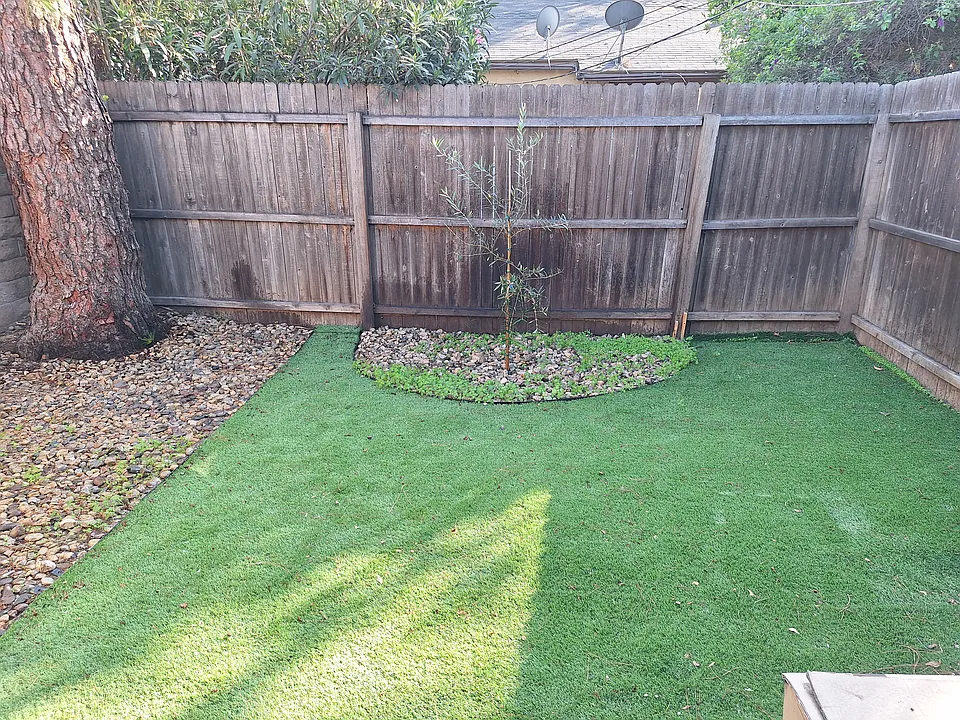 Wonderful outdoor area for small pets. The rocks to the left are for potty time and the backyard has its own hose for easy cleanup.