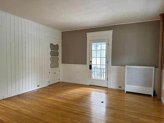 Living Room with door to wraparound front porch!