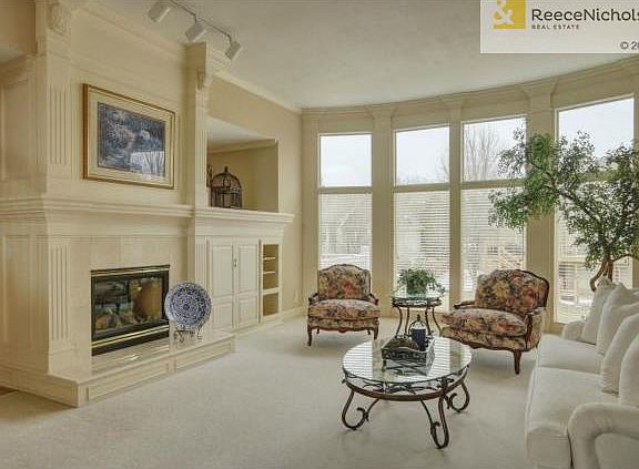 Living room with fireplace and floor to ceiling windows!