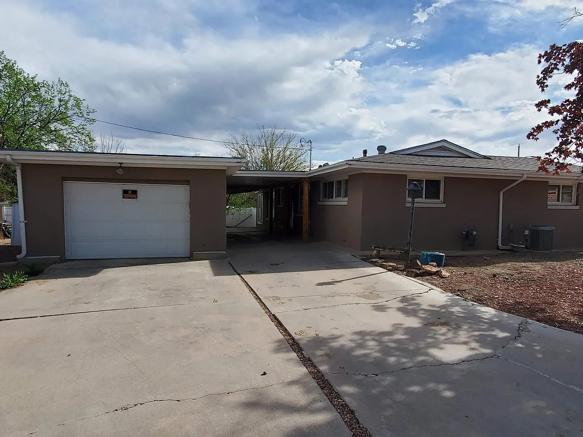 Back door entrance with single car garage and carport - 128 Yale Pl