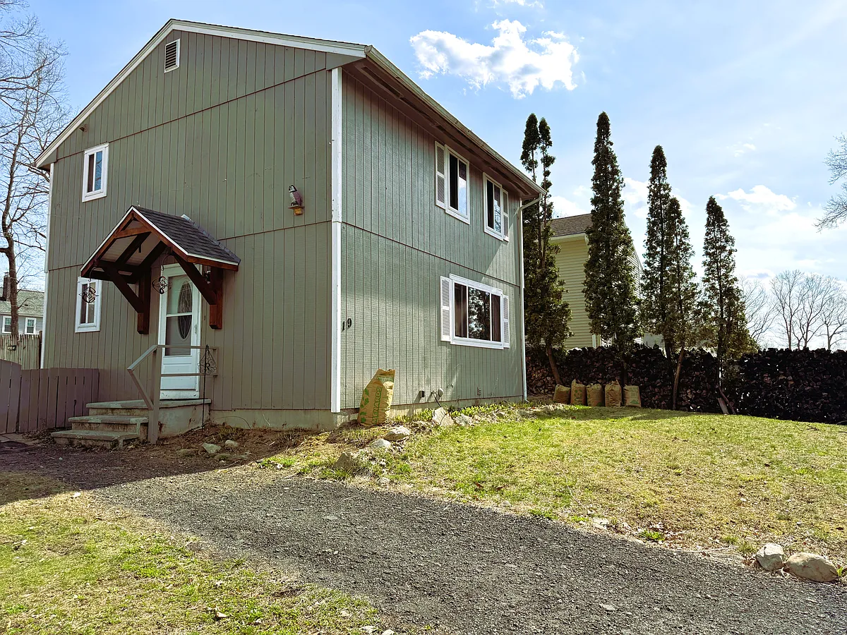 Front of home with Craftsman style covered entrance - 19 Gem Dr