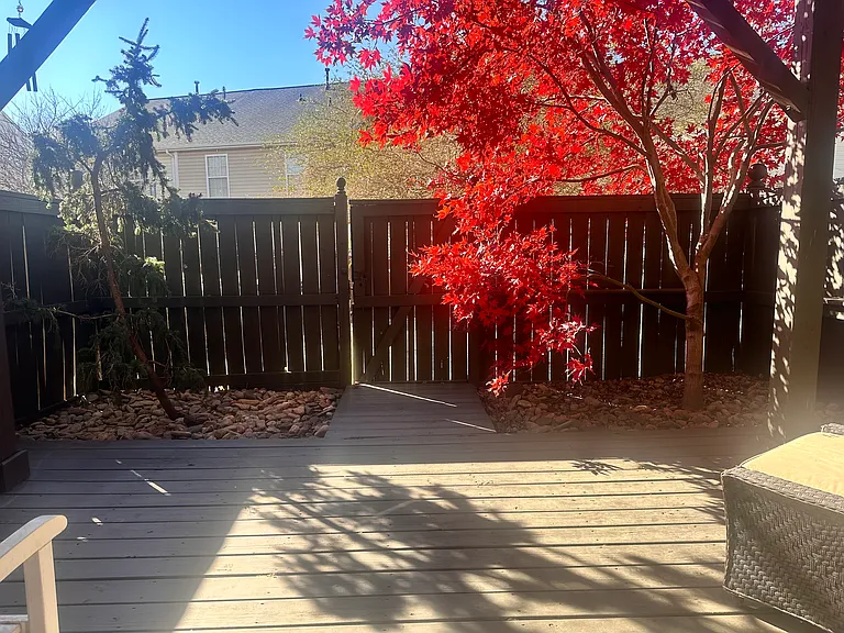Private patio with access to the first floor bedroom and door and gate to common area.