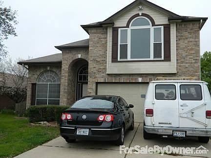 Front view
						:
						Brick and wood, 1.5 car garage with built-in shelves