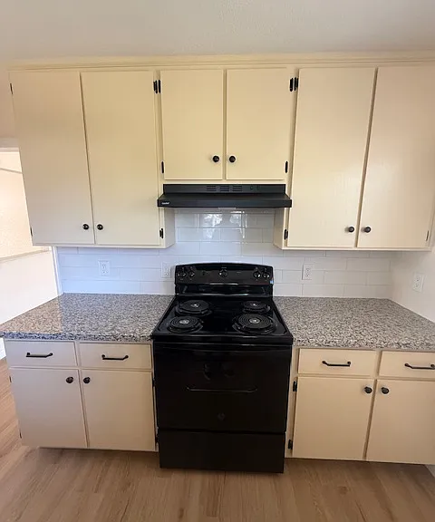 Beautiful kitchen with new counter tops and appliances.