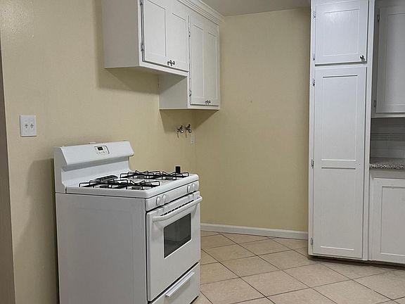 Electric Washing Machine & Gas Dryer hook-ups, in-unit; next to stove