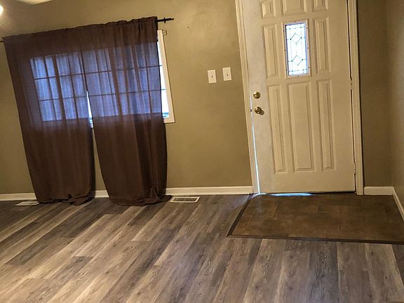 Front entry and living room with new floor.
