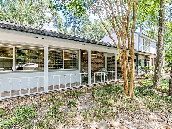This cute covered porch offers seating just outside the master retreat.