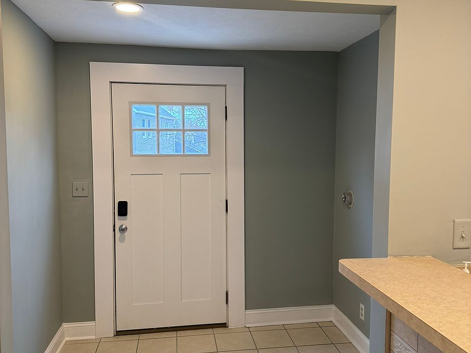 Back door with access to shared back yard, off street parking spot