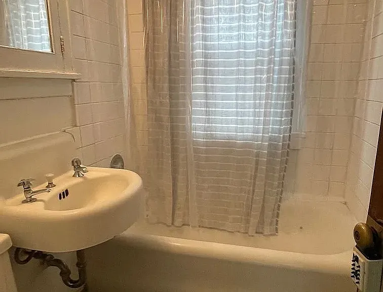 Elevate your living space at LS Capital Group with this beautifully designed bathroom featuring a spacious tub and modern fixtures. Enjoy comfort and style in every detail. Schedule your visit today to see more!