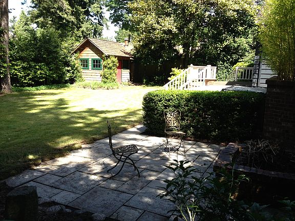 Back yard with garden shed and fire pit