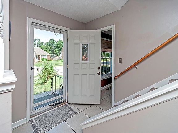 Ceramic tile flooring in entry tht carries through to the dining room