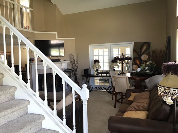 View of living room. French doors lead to sunroom/office sp
