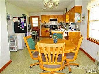 View of dining room looking into kitchen.
