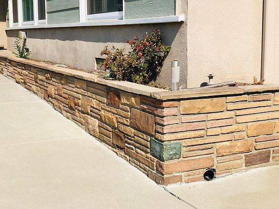 Raised flower bed with manual irrigation system