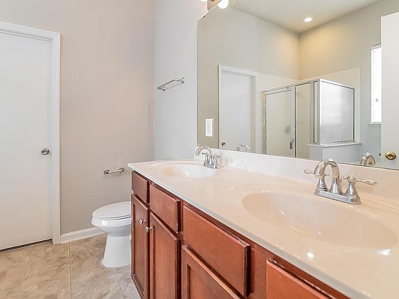 Master Bath has a double vanity, tub and shower.