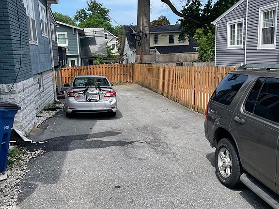Long Driveway for two tandem space parking. Entrance is just beyond silver car in the picture