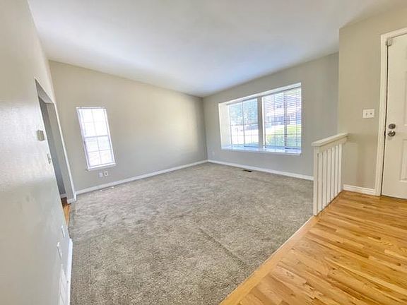 The living room gets a lot of natural light.