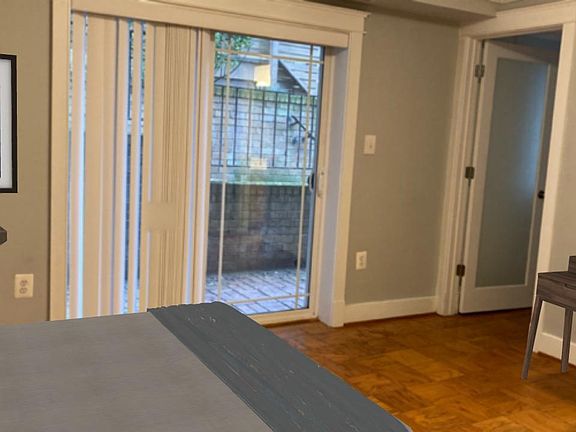 Bedroom with walk-in closet, en suite bath, private brick patio