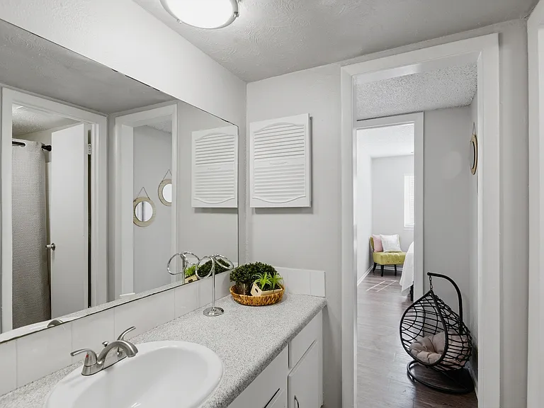 Welcome to Wymore 360 Apartments, where modern design meets functionality. This chic bathroom features elegant fixtures and ample storage, perfect for your everyday needs. Elevate your lifestyle today and schedule a tour!