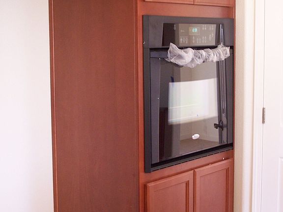 Beautiful Cherry Cabinets with Black Appliances