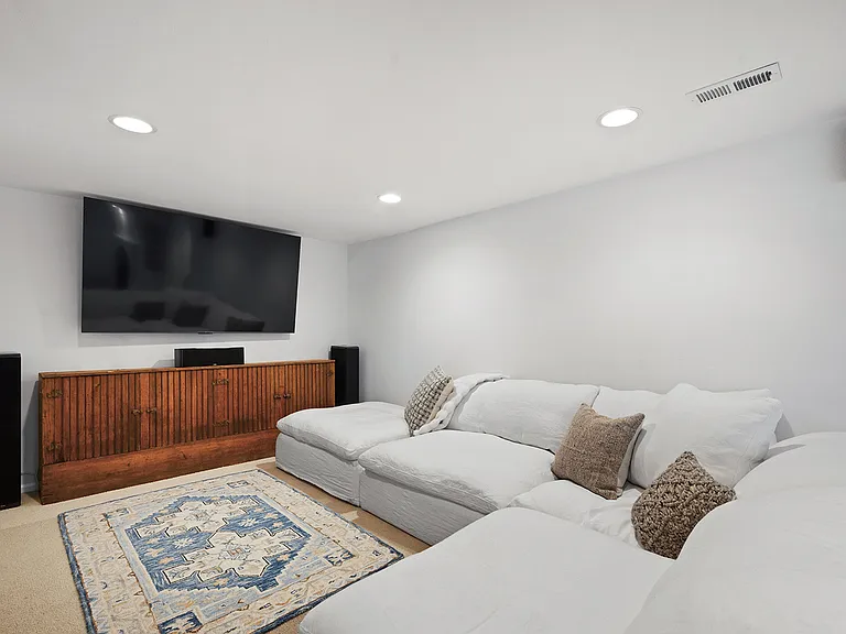 Media area of Bonus Room, with 70" tv and surround sound