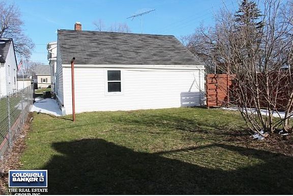 Backyard next to garage.