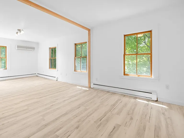 Dining Area to the right with Living Room to the left - Second Floor. These widows face West with a great view of Mouth Equinox in Winter, and partial view in Summer.