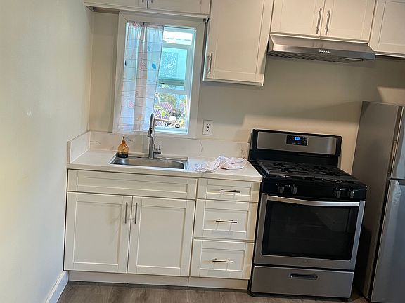 5th image of 8731 S Denker Ave