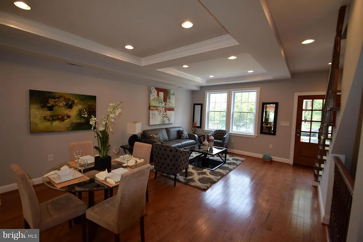 Living room/Dining room Pictures are with different furnitures. - 4922 7th St NW