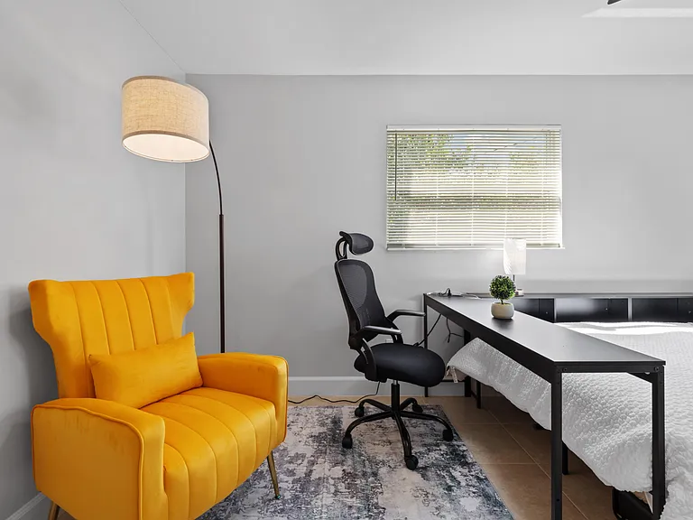 Your workspace ready to go desk, chair, accent armchair, floor lamp. Renovated 2026.