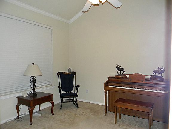 Study also offers vaulted ceilings, 2 inch blinds, crown molding and French doors.