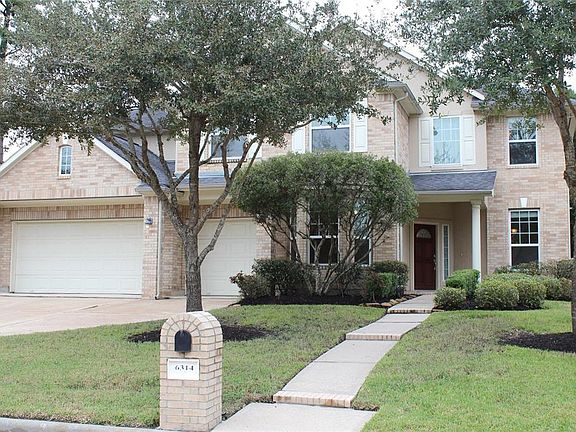 Matue trees and landscaping enhance the curb appeal of 6314 Cash Oaks Dr.