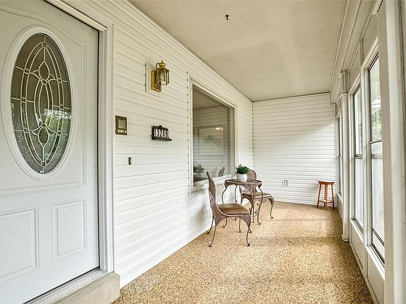 Glass/screened porch as you enter the home.