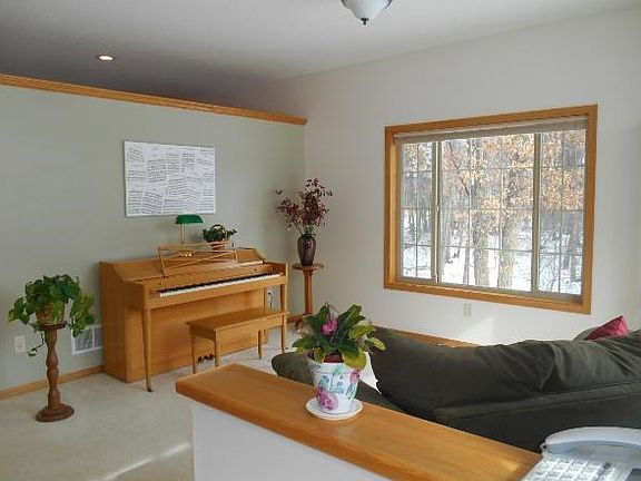 Sitting room/music room with plenty of natural light.