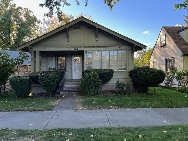 Front porch entry with enclosed glass sitting room