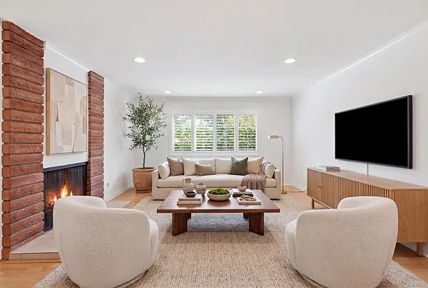 Living room/family room, with dual sided-fireplace.