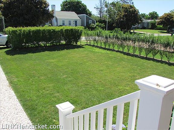 Newly landscaped yard with irrigation and new hedges.