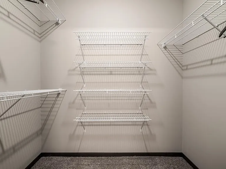 Our large walk-in closets feature ample built-in shelving.