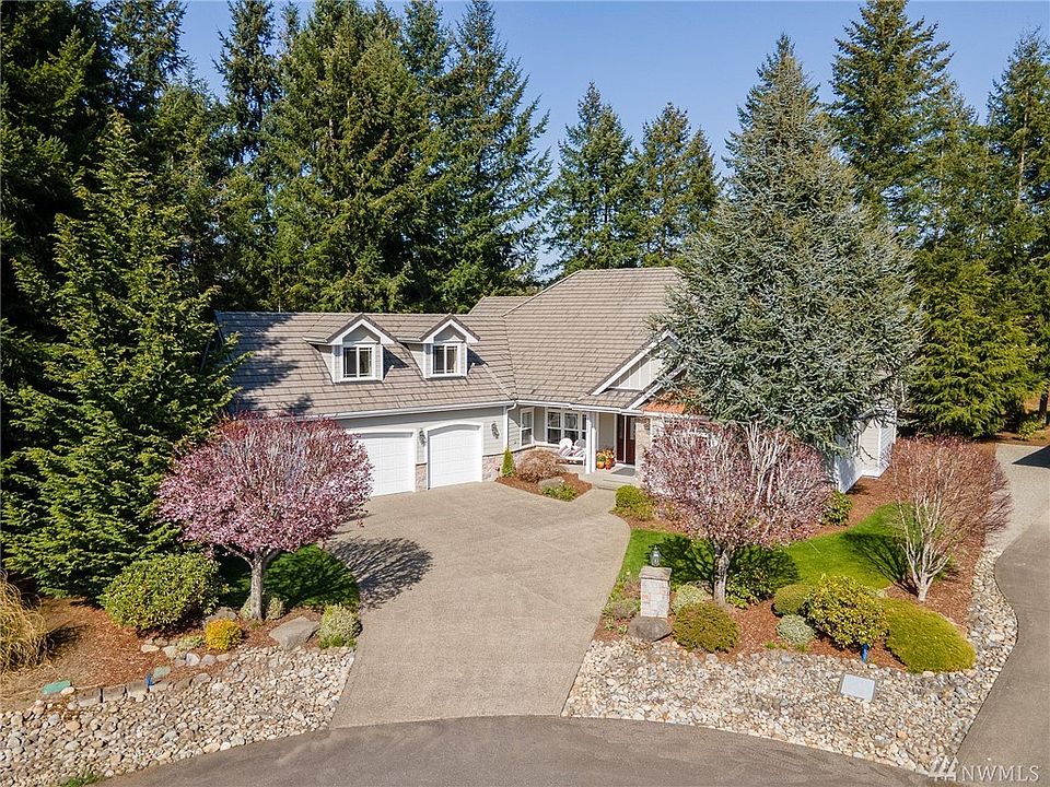 Privacy and luxury abound on this flat, gated cut-de-sac. 