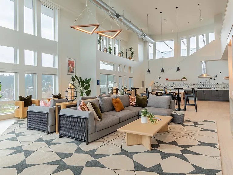 Relax in the Sky Lounge with large HDTV, kitchen and workspace