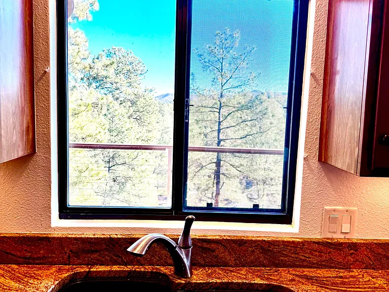 Composite grey/black sink faces stunning views
