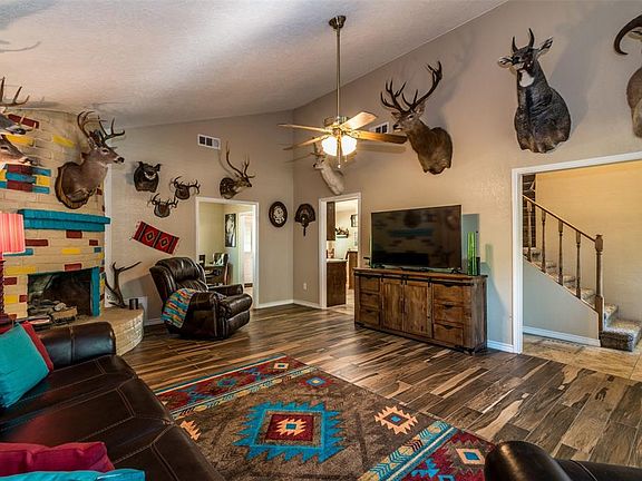 Living area , looking into the kitchen and formal dining area.